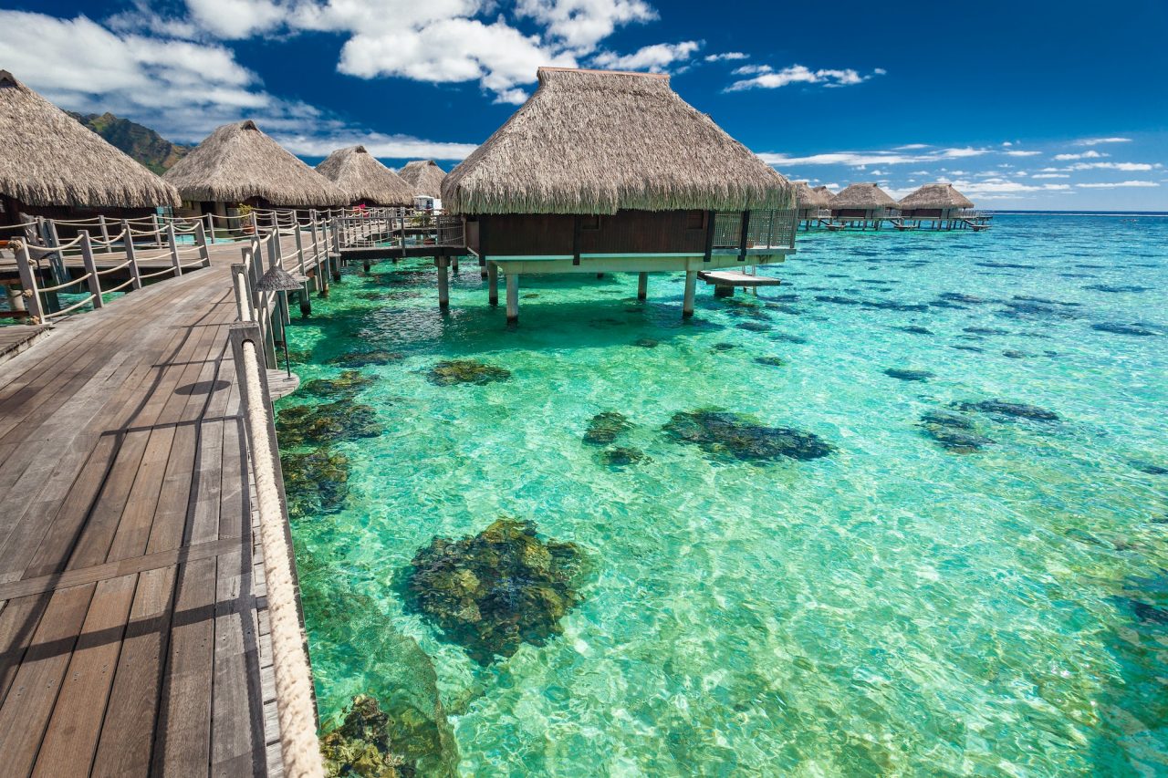 over-water-villas-on-a-tropical-lagoon-of-moorea-island-tahiti.jpg